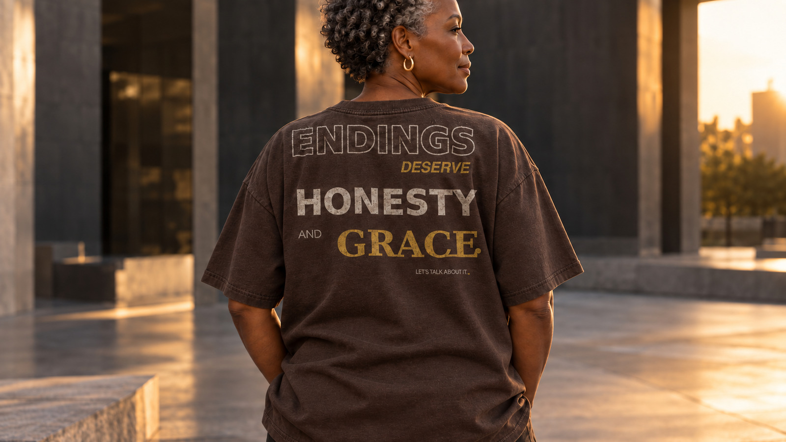 Black model wearing the Endings Deserve Honesty and Grace statement tee in Espresso
